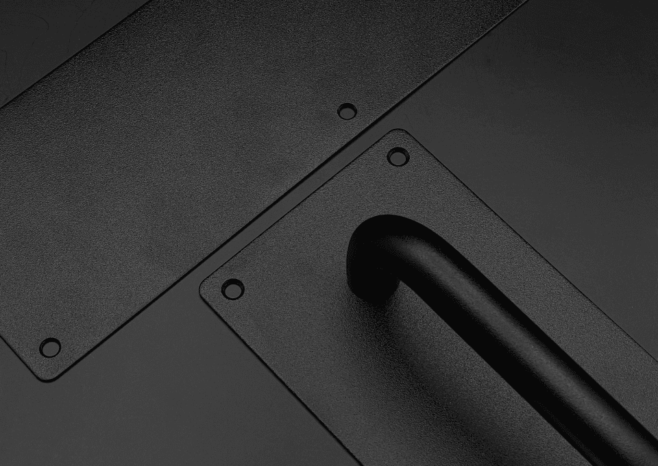 Matt black commercial pull handle on a dark door
