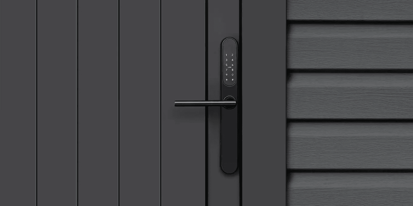 Digital entry lock fitted to a dark exterior door